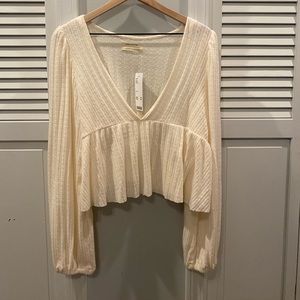 Urban Outfitters cream peplum blouse